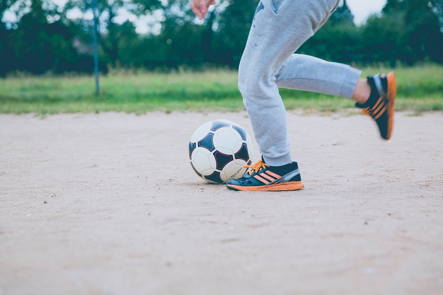 young-boy-playing-soccer