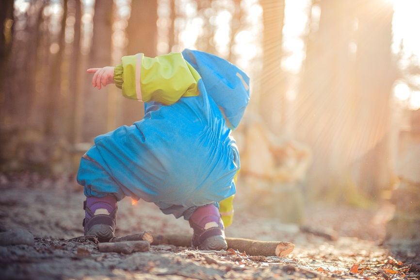 child playing in the dirt