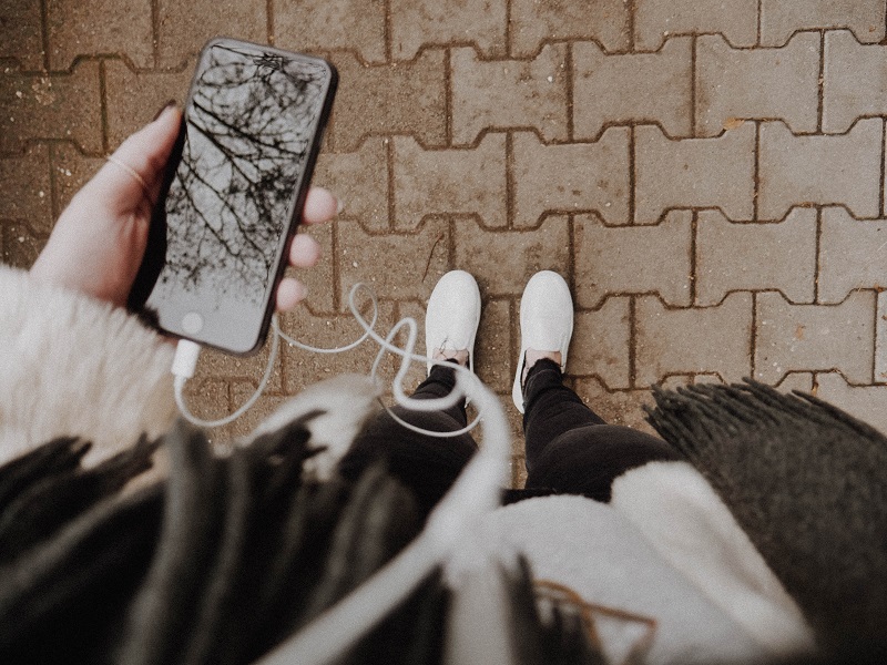 woman-with-phone-and-headphones